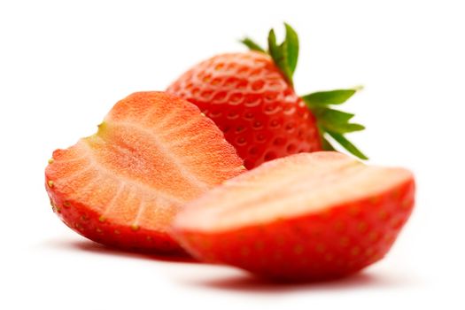 strawberries is sliced in half on white background