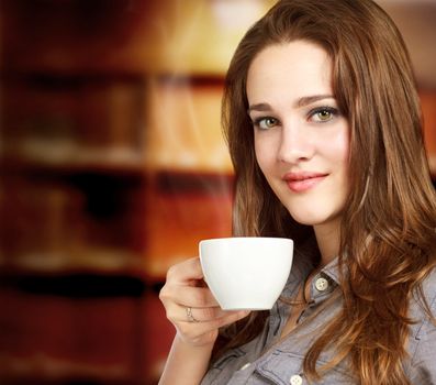 Beautiful Young Women Drinking a Cup of Coffee or Tea