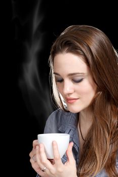 Beautiful Young Women Drinking a Cup of Coffee or Tea