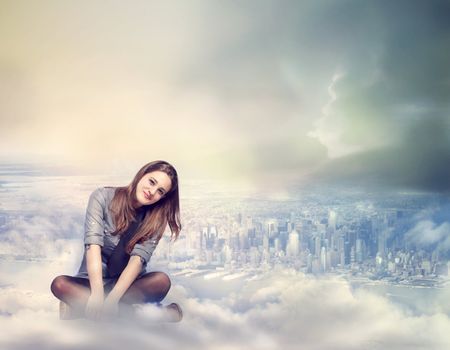 Happy Young Woman Sitting on the Clouds