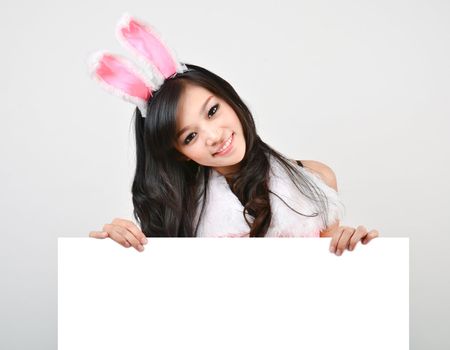 Sexy bunny girl hold white board Isolated on gray background