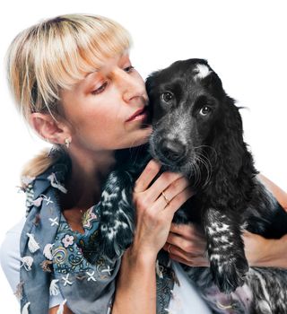Young cocker spaniel and young woman on white background