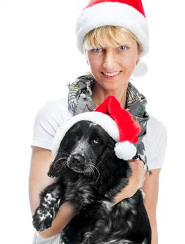 pretty young woman and dog in santa hat at Christmas over White background