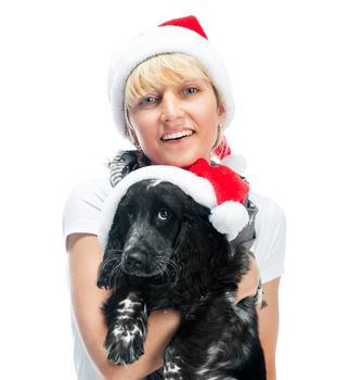pretty young woman and dog in santa hat at Christmas