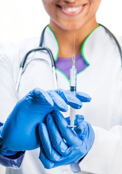 doctor holding a syringe in hands