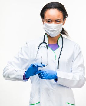 doctor holding a syringe in hands over white