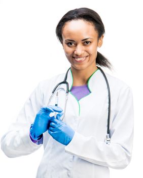 Smiling doctor holding a syringe in hands
