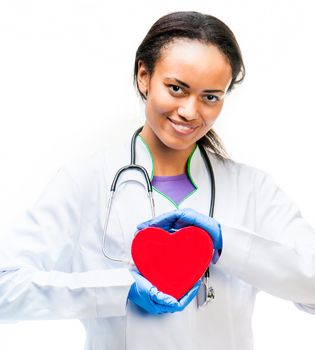 Smiling doctor holding red heart symbol on white background