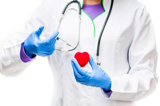 Doctors hands with Syringe and red heart on a white background