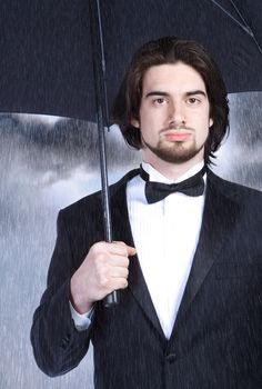 Portrait of a Young Stylish Man with Umbrella