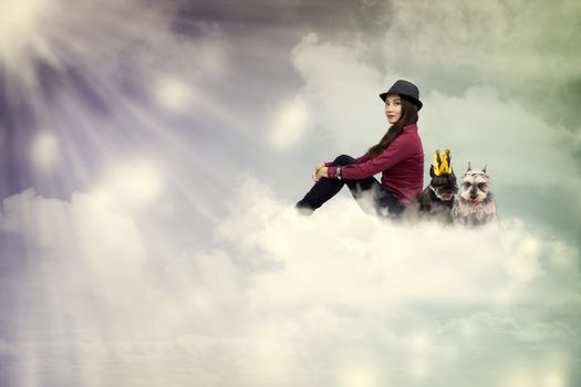 Young woman sitting on the cloud with dogs in vintage style
