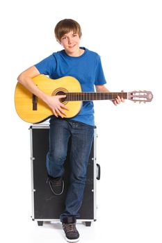 Cute boy with classical guitar. Isolated on white background