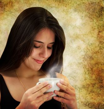 Beautiful young woman holding a coffee cup 