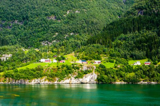 Idyllic view fjord, village and mountains of Norway