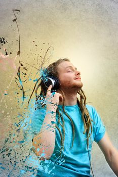 Portrait of a Young Man with Dreadlocks Listening to Music on Headphones 