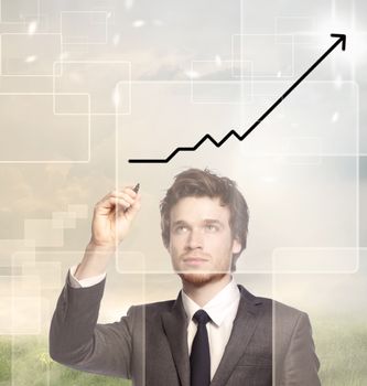 Businessman drawing a graph with black marker (growth)