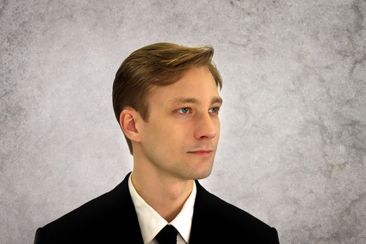 Young business man in black suit 