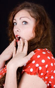 young scared, terrified woman holding hand on face isolated over white background
