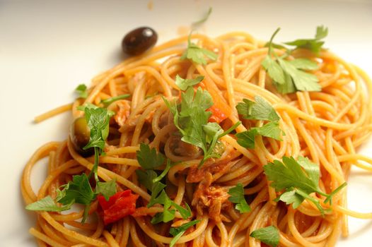 The making of a typical italian receipt, spaghetti with puttanesca sauce