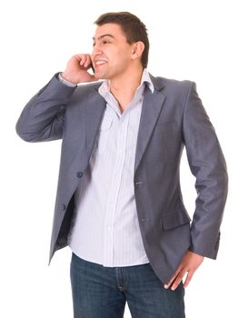 Young casual man in jeans and jacket with phone isolated on white background