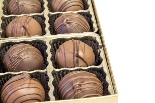 Box of Dark and Milk Chocolate Truffles with Swirls Closeup