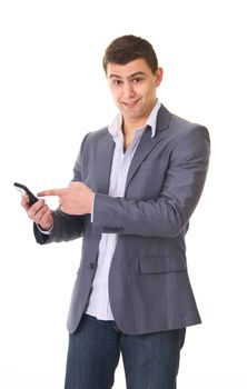 Young casual man in jeans and jacket with phone isolated on white background
