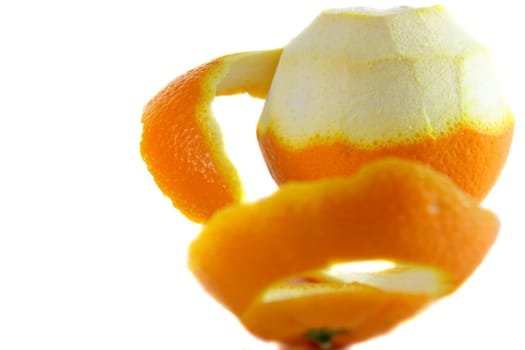 peeling one orange on white isolated background