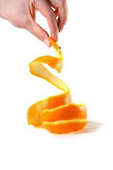 hand holding peel of orange on white backrgound