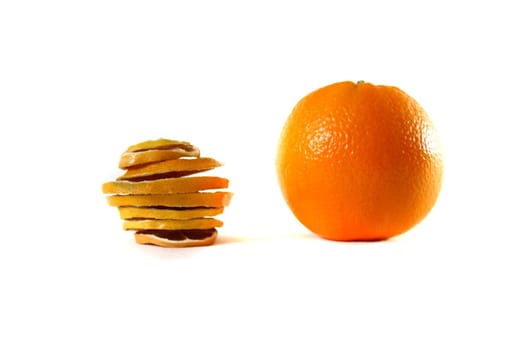 Dried sliced orange and fresh orange together on white background