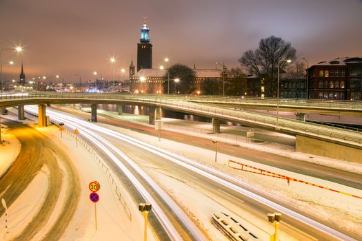 Stockholm Cityhall at night with transportation light trail Sweden