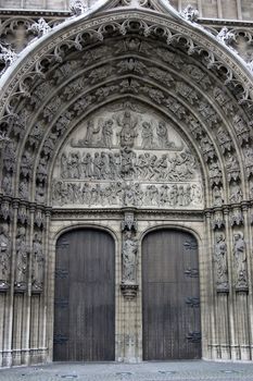 Bronze door entry to famous Vrouwekathedraal - Cathedral of our Lady in Antwerp