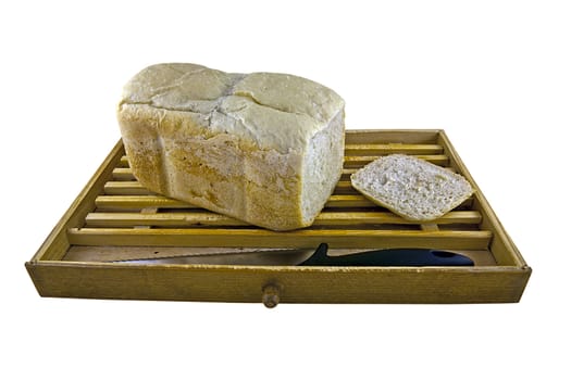 A home-made white bread with crumb catcher and knife