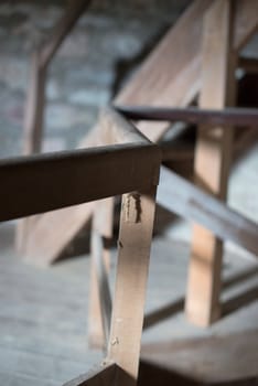 old wooden stairs in the roof of an abandoned building