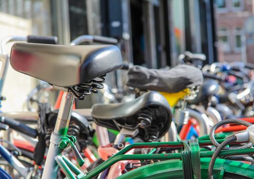 Detail of bikes parked in a center street of Amsterdam