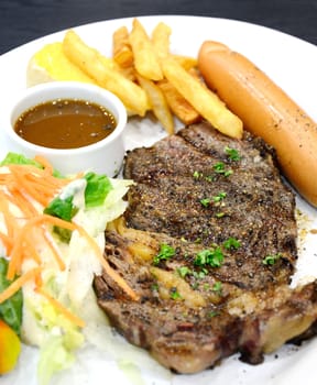 Lamb steak with black pepper on dish