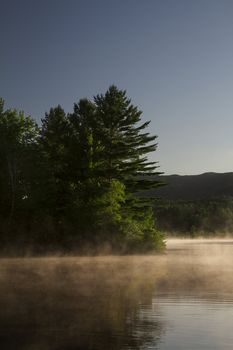 Lake covered with fog early in the morning