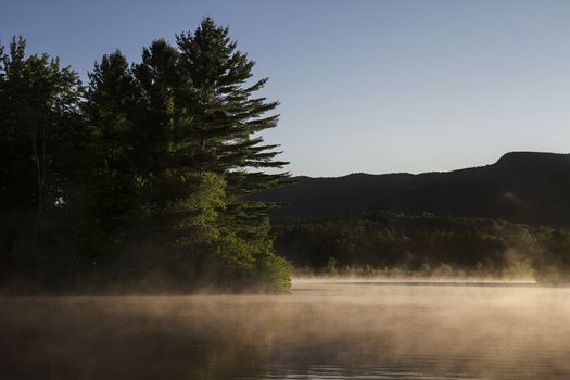 Lake covered with fog early in the morning