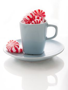 small blue coffee cup with red and white swirl mint