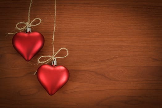 wooden board for valentine message with two red hearts