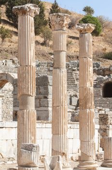 Classical columns in ancient Ephesus. Ephesus was an ancient Greek city and later a major Roman city. It was once the commercial centre of the ancient world and now it is the largest classical archaeological site in the world.