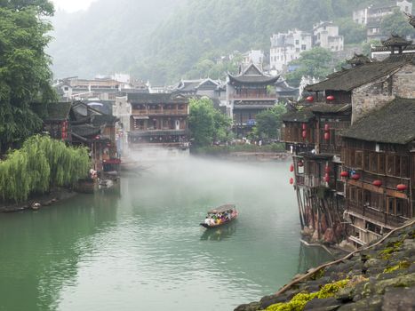 HUNAN, CHINA - JULY 7: View of Tuojiang River on July 7, 2010 in Fenghuang county, China. The ancient town of Fenghuang was added to the UNESCO World Heritage Tentative List in the Cultural category.