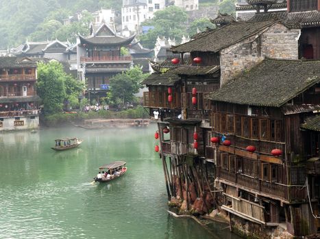 HUNAN, CHINA - JULY 7: View of Tuojiang River on July 7, 2010 in Fenghuang county, China. The ancient town of Fenghuang was added to the UNESCO World Heritage Tentative List in the Cultural category.