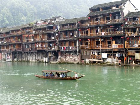 HUNAN, CHINA - JULY 7: Old houses in Fenghuang county on July 7, 2010 in Hunan, China. The ancient town of Fenghuang was added to the UNESCO World Heritage Tentative List on March 28, 2008 in the Cultural category.
