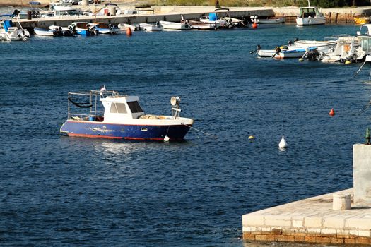 Small motorboat on the blue sea