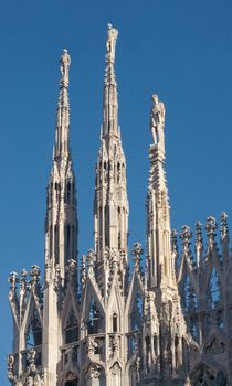 Statues of the Duomo in Milan on a winter evening