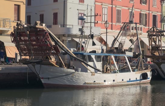 Small fishing boat moored in Cervia, Italy