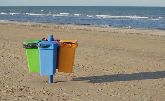 Garbage cans on the beach in Cervia in Italy