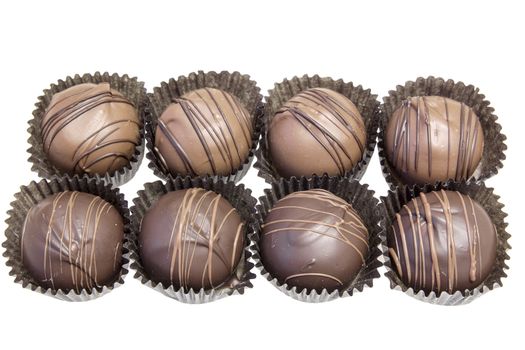 Group of Eight Dark and Milk Chocolate Truffles Bonbon Isolated on White Background