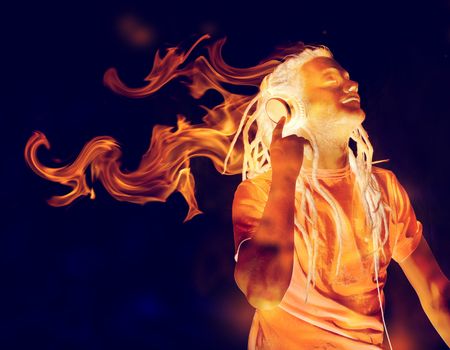 Young Man Listening to Music on Headphones in Flames