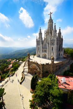 Tibidabo church on mountain in Barcelona with christ statue overviewing the city